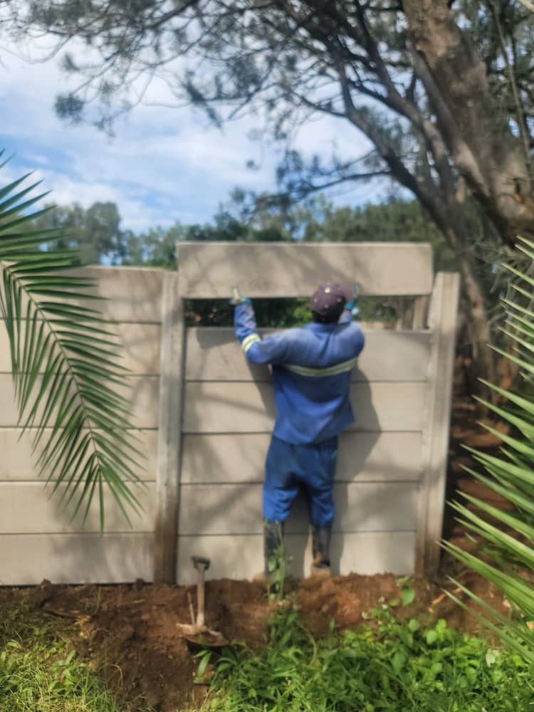 Worker installing wall